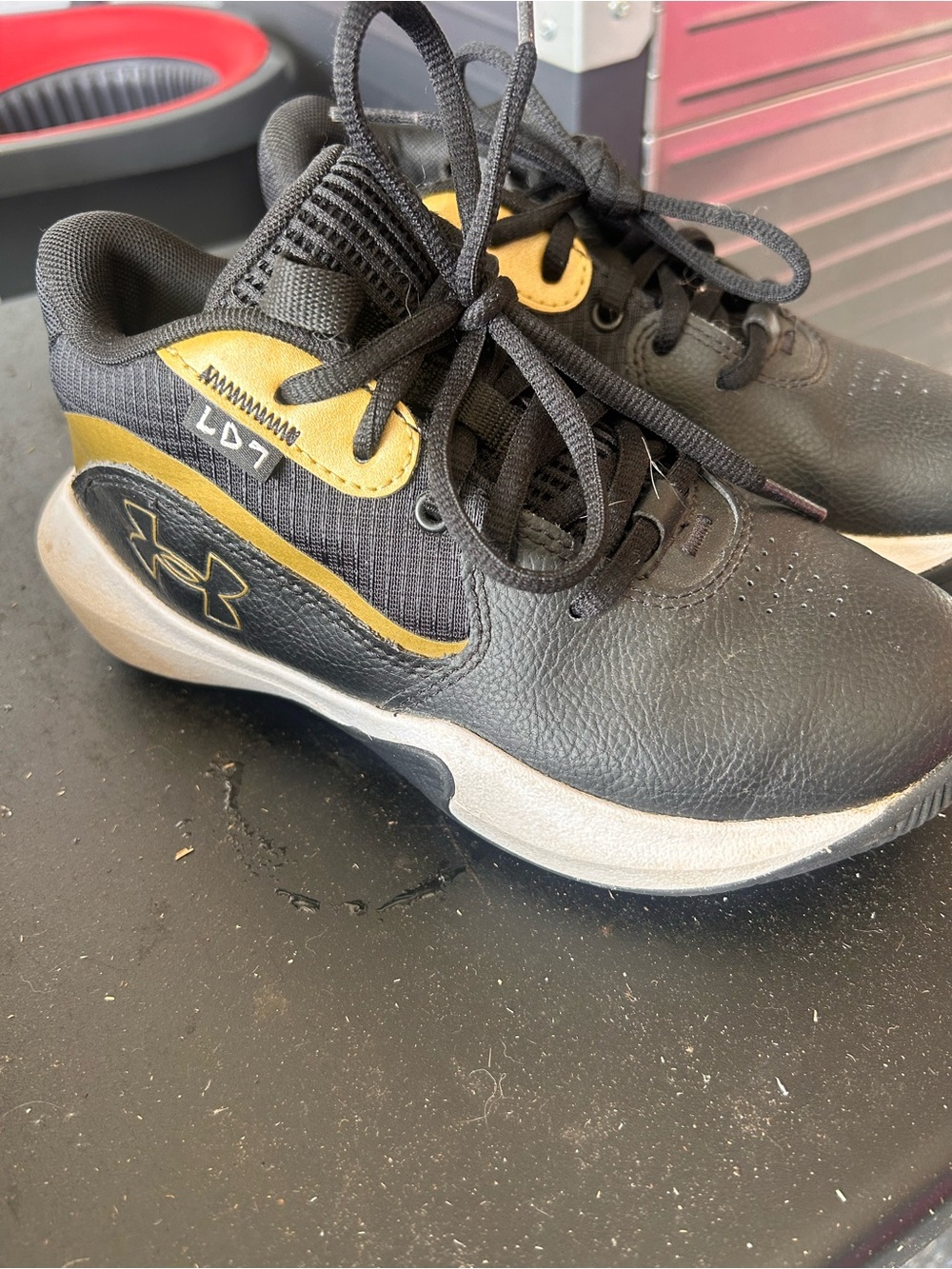 Under Armour Black and Gold Lace-Up Athletic Shoe